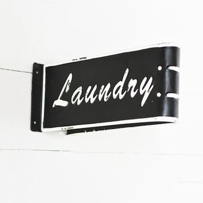 Laundry Folded Tin Sign 12"